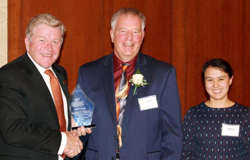 Rodney Peltzer was presented his award by Eric Paterson, alongside Theresa Blandino.