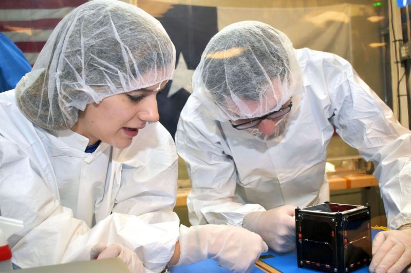 Students work on manufacturing and assembly of Virginia Tech’s CubeSat satellite at Space@VT.