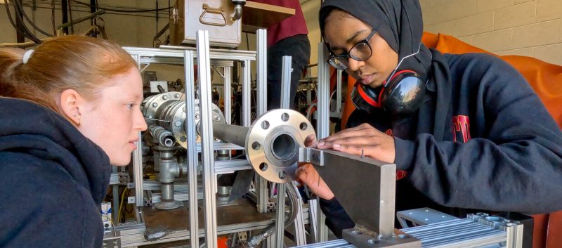 students working on an engine test cell