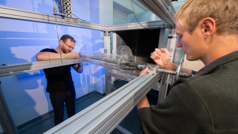 Students setting up a circular cylinder model