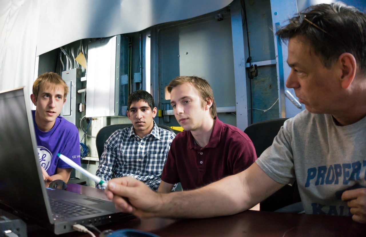 Tunnel engineer mentoring undergraduate students during laboratory experiment
