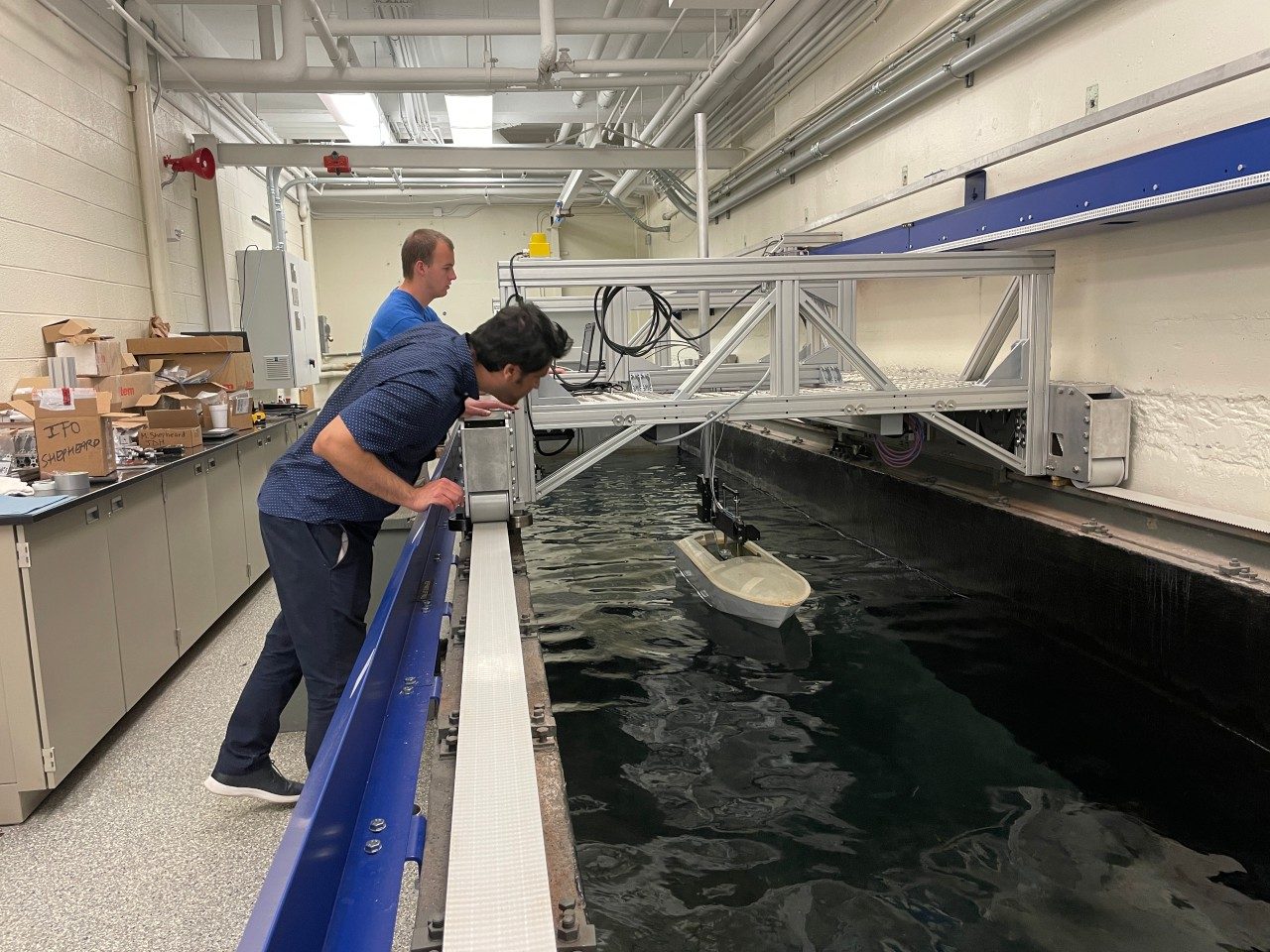 Mark Shepheard and M. Javad Javaherian conduct controlled motion slamming experiments in the upgraded towing tank, using a generic prismatic planing hull (GPPH) model.