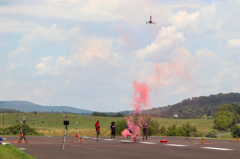 This image  shows Tavon Hill, David Schmale, and his team flying drones.